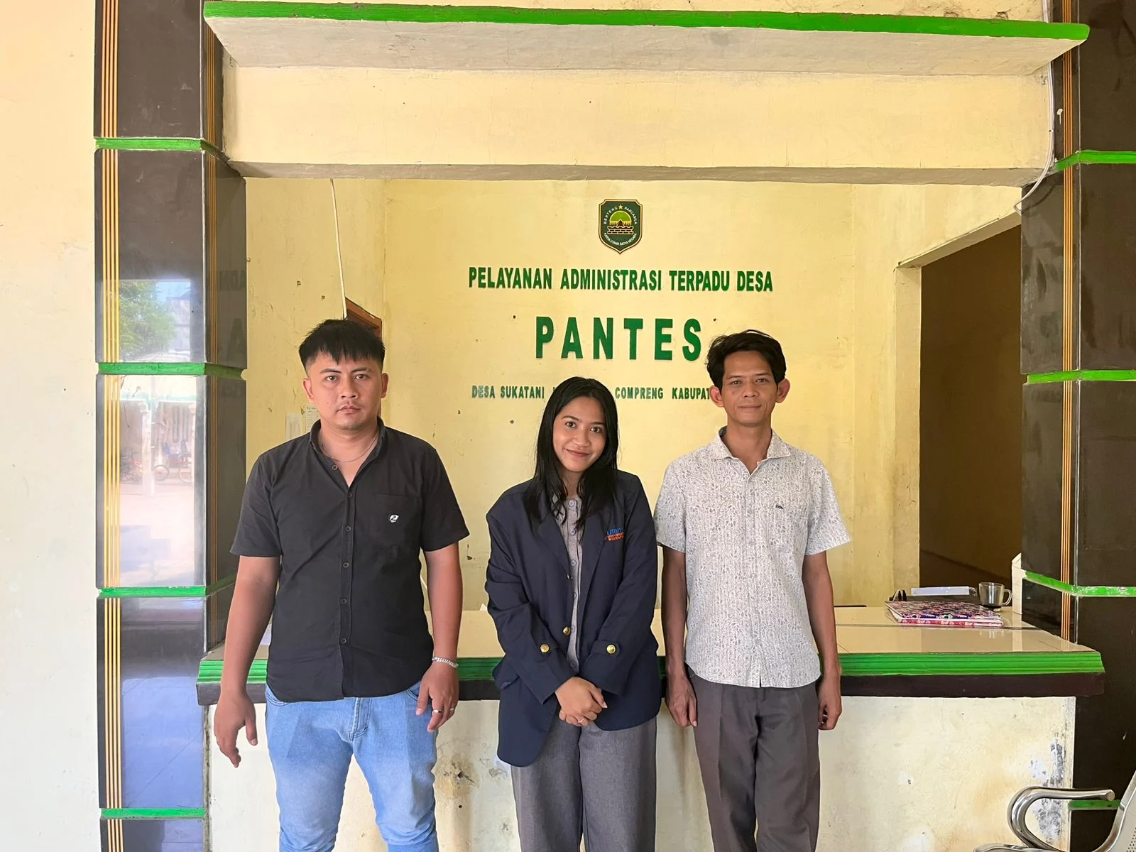 Adelia with local staff at Sukatani Village service office
