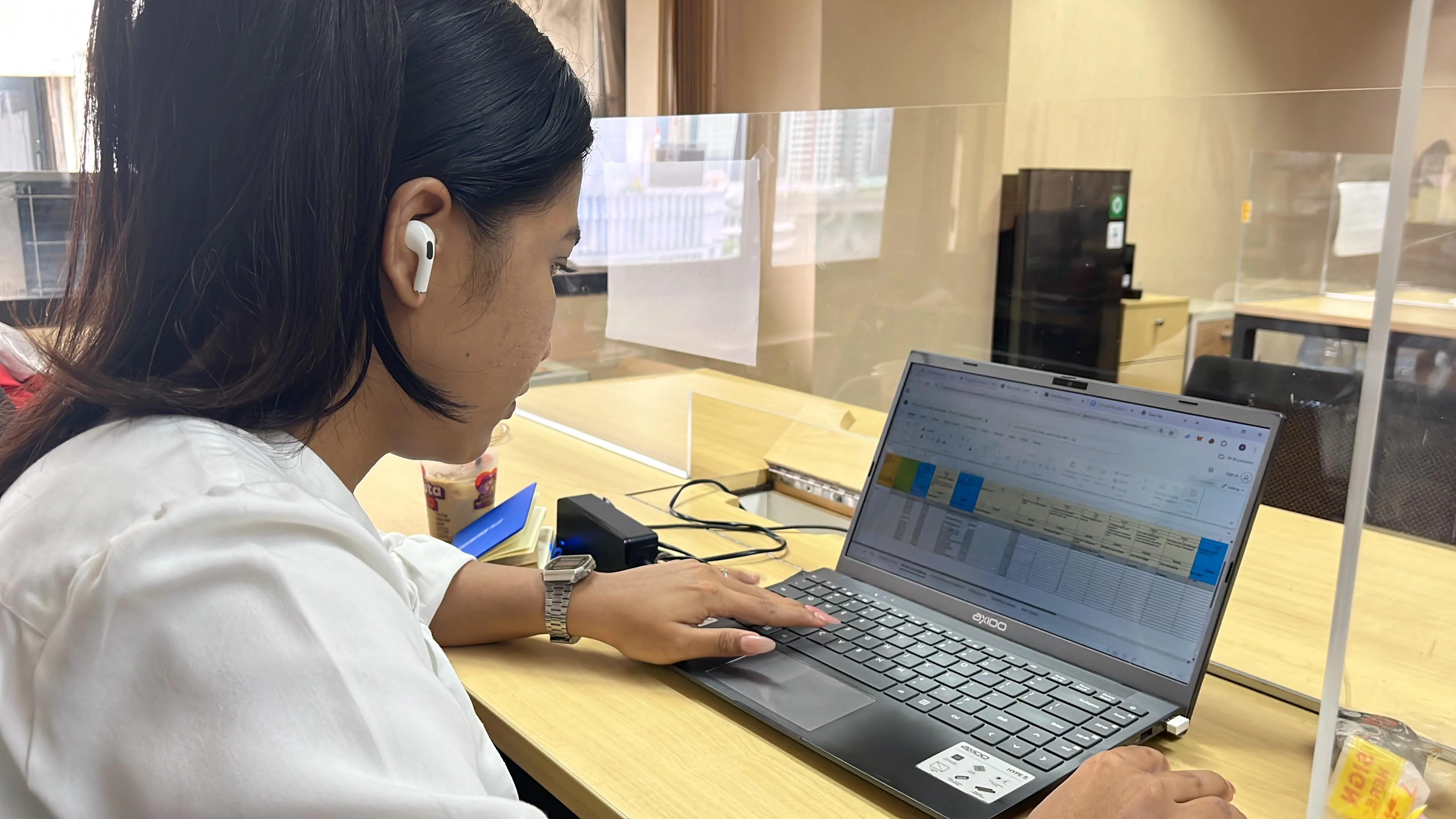 Adelia working on data at PT PLN Indonesia Power